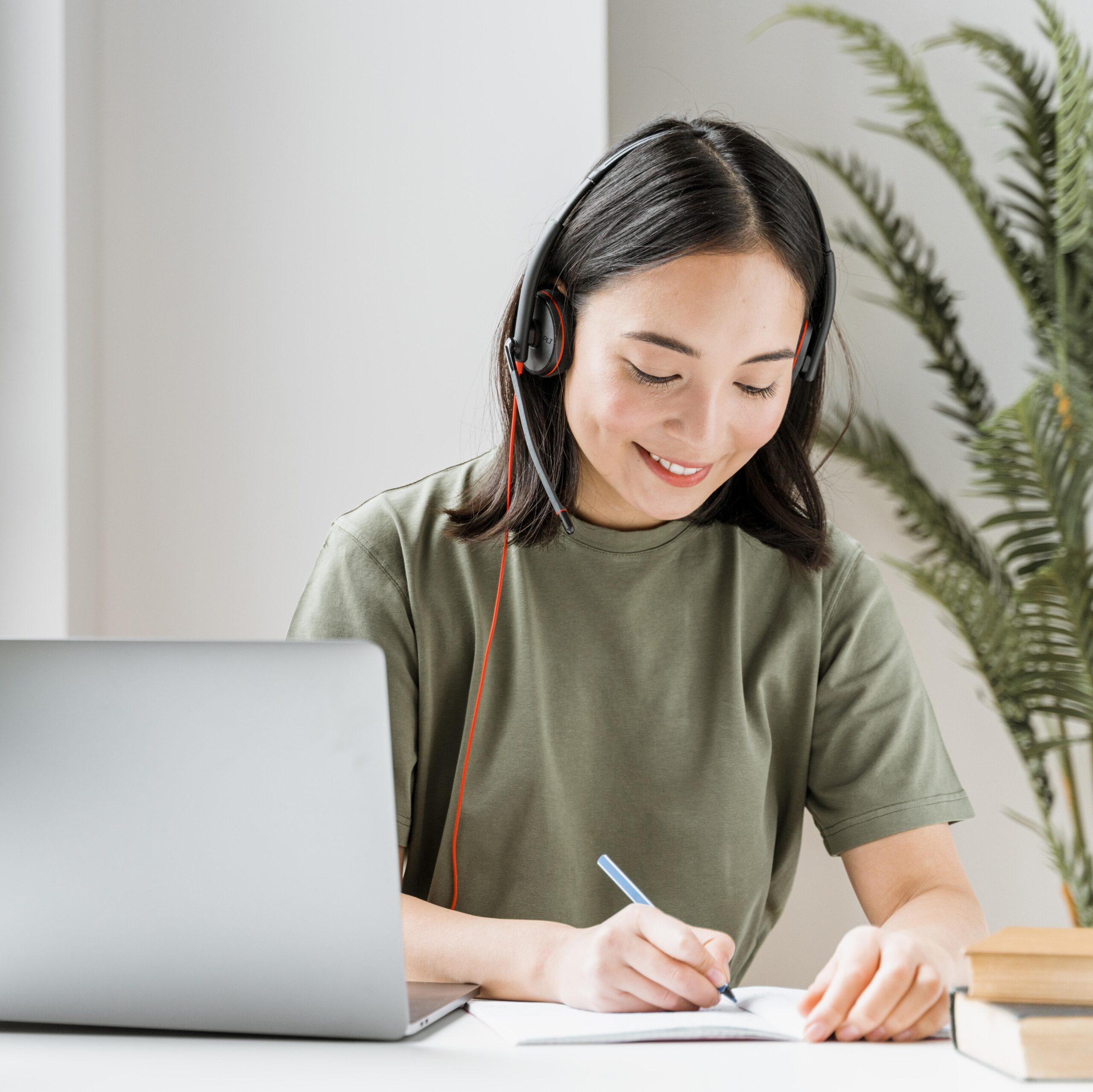 woman-with-headset-having-video-call-laptop